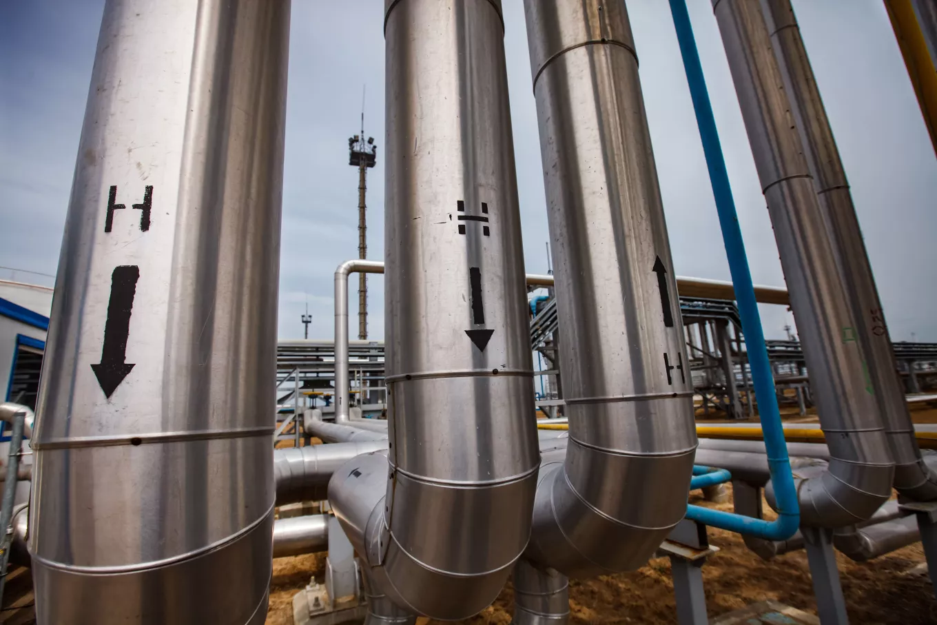 Grey metal Technological tubes and pipelines with arrows and Hydrogen "H" signs. 