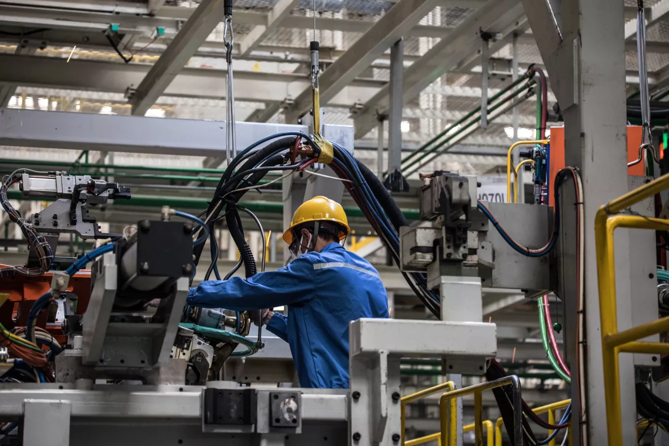 Workers in machinery factory 