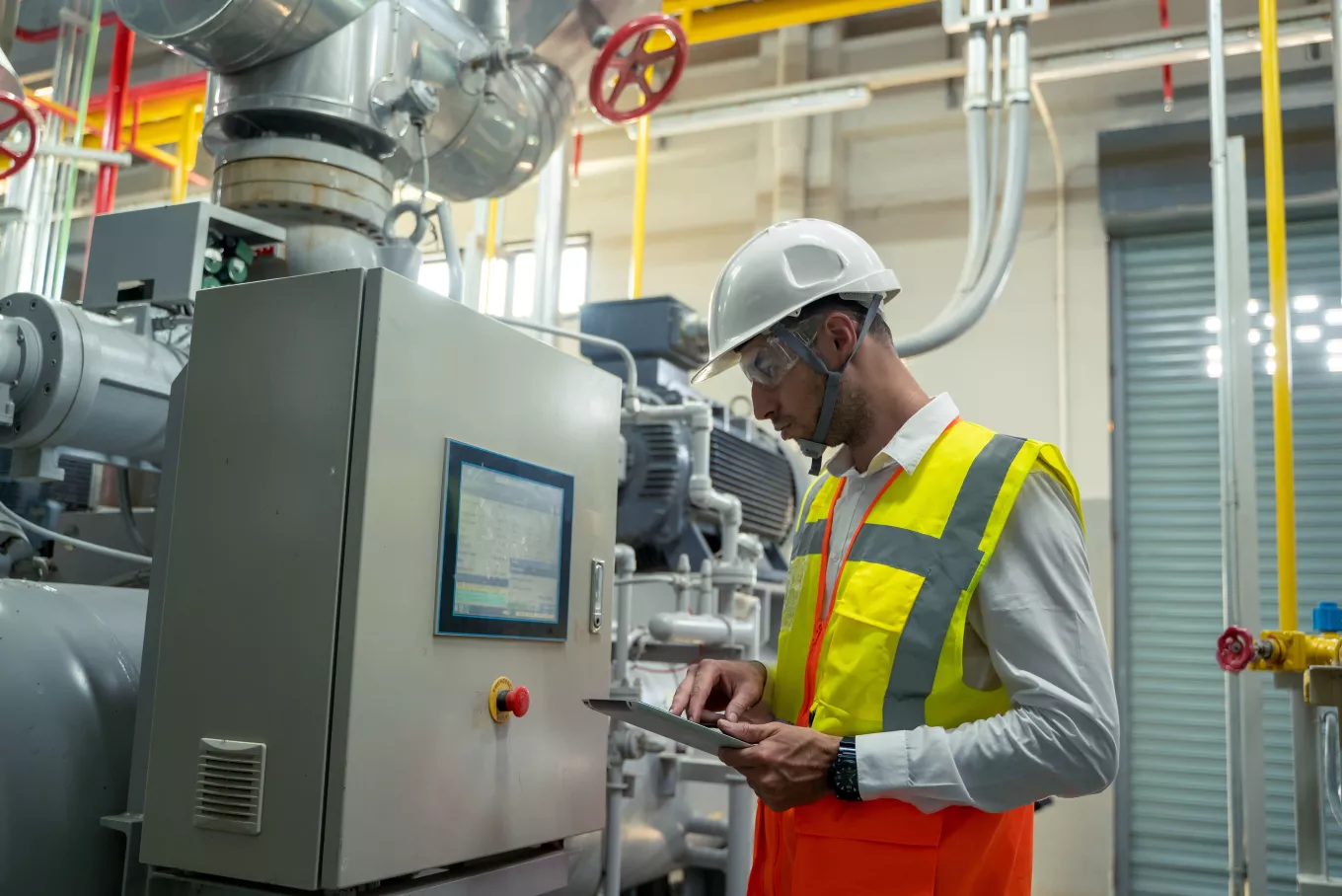 echnician engineer checking controls system for security functions in service room at factory,Heating,Ventilation,Air Conditioning.
