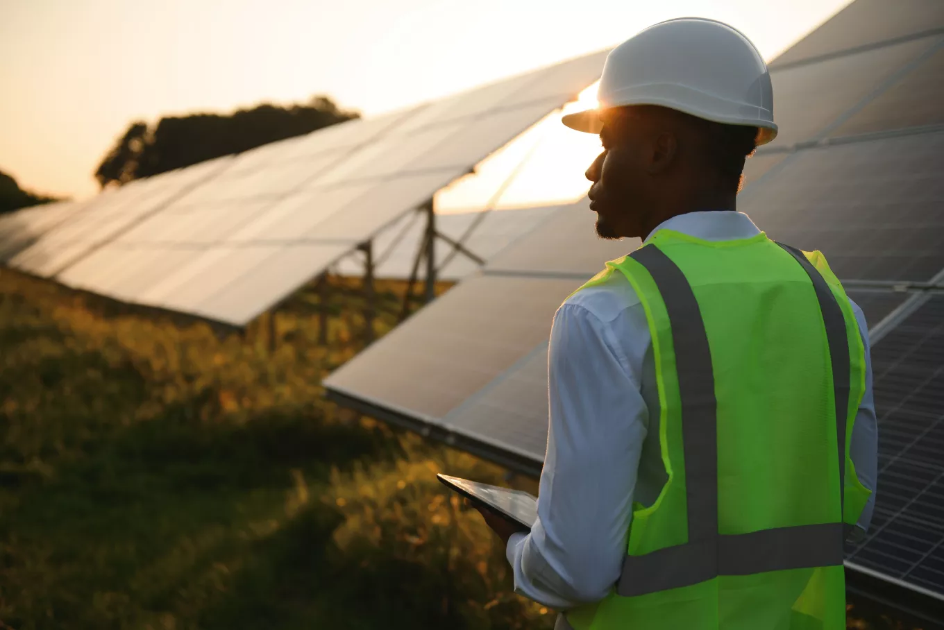 technician check the maintenance of the solar panels. Black man engineer at solar station.