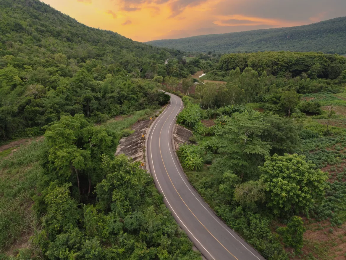 Country roads, farmland and green forests, drone aerial shot