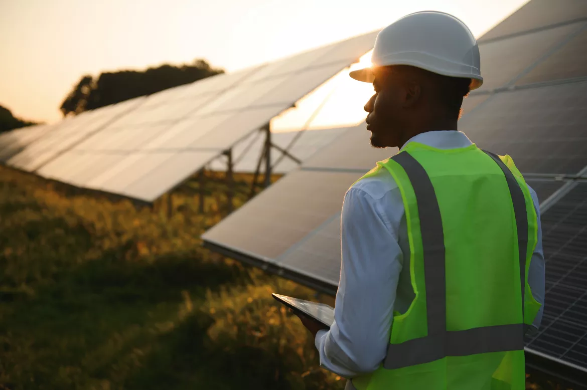 technician check the maintenance of the solar panels. Black man engineer at solar station.