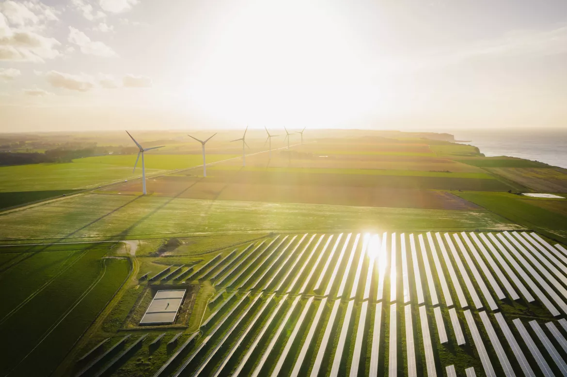 olar panels farm in a field. Renewable green energy. Sunny landscape, electric energy generator for clean energy producing concept.