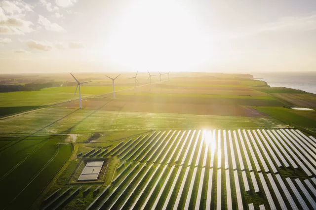 olar panels farm in a field. Renewable green energy. Sunny landscape, electric energy generator for clean energy producing concept.