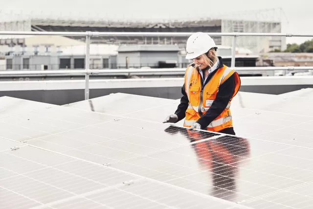 Woman working on solar pv
